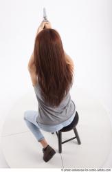 MOLLY SITTING POSE WITH GUN